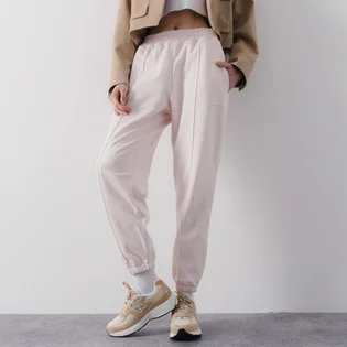 Штани жіночі New Balance Pant Jogger Athletic Pink WP23553WAN