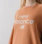 Світшот жіночий New Balance Sweat Crew Graphic Essential Orange WT31508SEI