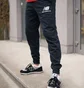 Штани чоловічі New Balance Nb Ess Stacked Logo Black MP03558ECL