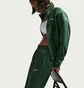 Штаны женские Nike Sportswear Windrunner Mid-Rise Slim Knit Green HJ1016-323