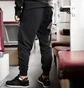 Штаны мужские New Balance Nb Ess Stacked Logo Black MP03558BK