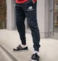 Штани чоловічі New Balance Nb Ess Stacked Logo Black MP03558ECL