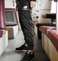 Штаны мужские New Balance Nb Ess Stacked Logo Black MP03558BK