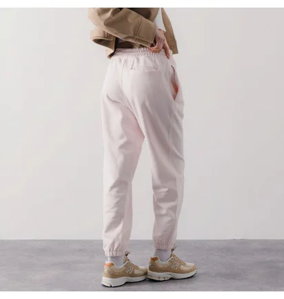 Штани жіночі New Balance Pant Jogger Athletic Pink WP23553WAN